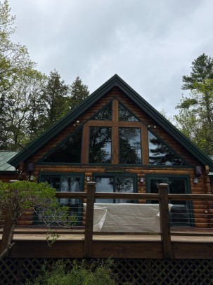 Log cabin front view with crystal clear windows